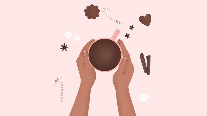 A simplified flat lay style illustration of two light brown hands holding a pink mug filled with hot chocolate, surrounded by three pieces of meringue, two gingerbreads, two cinnamon sticks, three star anise and a couple of candy canes on a very light pink background by Mervi Eskelinen
